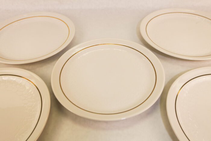 Ivory dinner plates w/ gold trim- #61